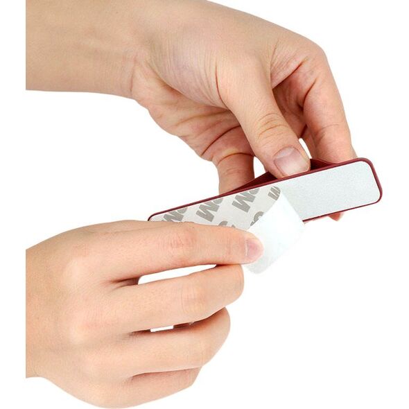 Hurtel Samoprzylepny uchwyt do telefonu na palec z suwakiem pomarańczowy Samoprzylepny uchwyt do telefonu na palec z suwakiem pomarańczowy 13538126 9145576281857