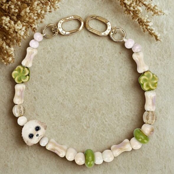 Zawieszka na torebkę handstrap Nimmy New Big Eye Cute Pets 2.0 brązowy