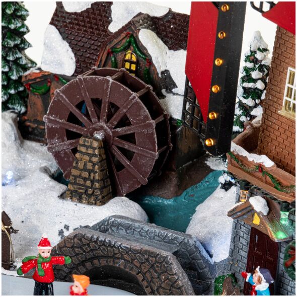 Χριστουγεννιάτικο χωριό με φωτισμό και κινούμενο ανεμιστήρα